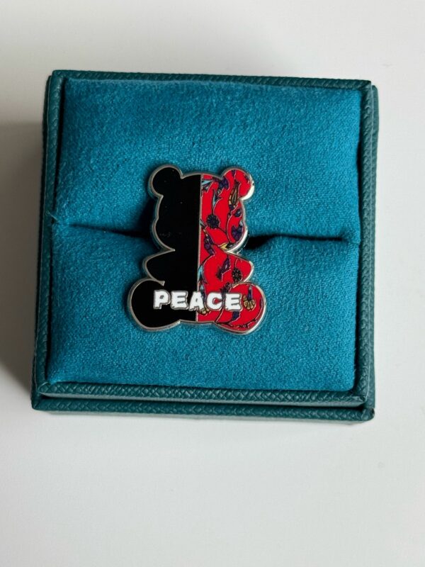 War Tears, Peace Repars Pin Rounded